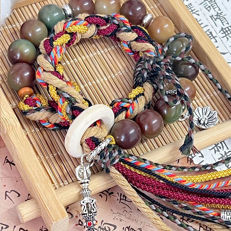 "Gesang" cordón tibetano tejido a mano de raíz de bodígan pequeño libro rojo pulsera nacional tejida productos terminados de venta caliente