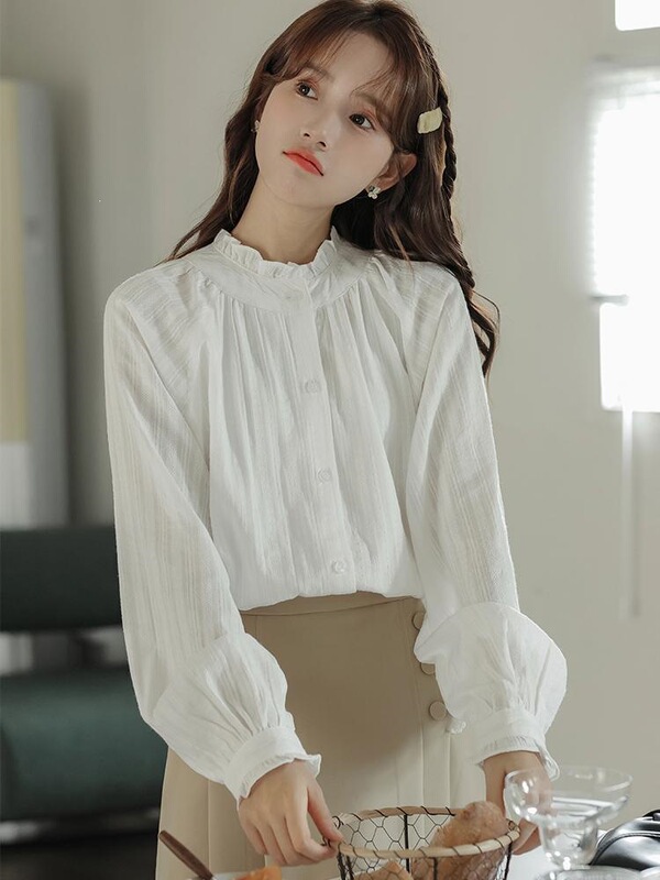 White women's shirt, new autumn style, with ruffled stand-up collar and long sleeves, a uniquely designed, sweet and unique top White women's shirt, new autumn style, with ruffled stand-up collar and long sleeves, a uniquely designed, sweet and unique top