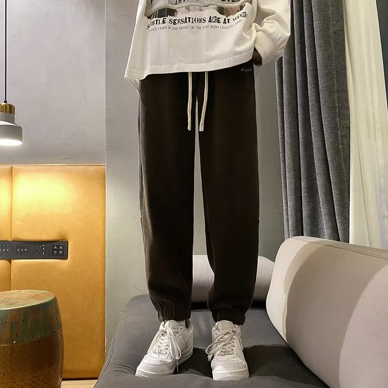 2024 nueva marca de moda pantalones deportivos coreanos pantalones de otoño para hombres pantalones casuales de otoño e invierno pantalones de protección de pies de moda para hombres