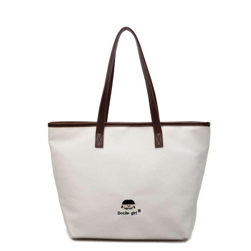Bolsa de lona de gran capacidad para mujeres 2025 nuevo estilo urbano simple de viaje al trabajo sensación de alta calidad de moda versátil bolso de mano