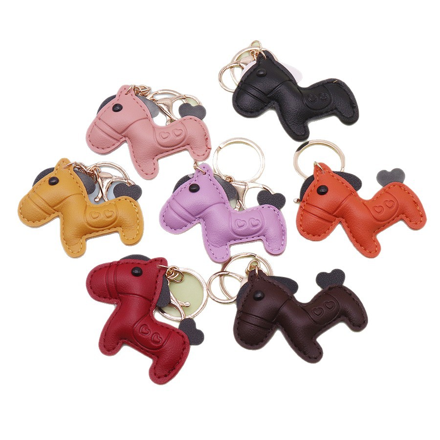 Inmediatamente rico lindo pony llavero colgante pareja bolso de cuero colgante coche eléctrico llave colgante de dibujos animados