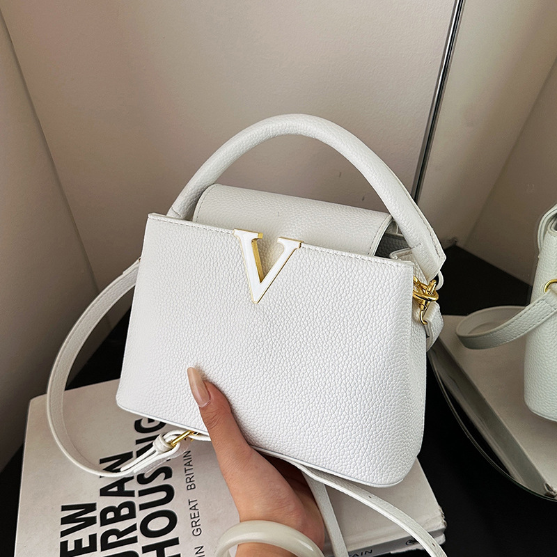 Bolso de textura transfronteriza 2025 verano nuevo bolso femenino simple patrón de lichi bolso de hombro con letras de moda bolso de mensajero