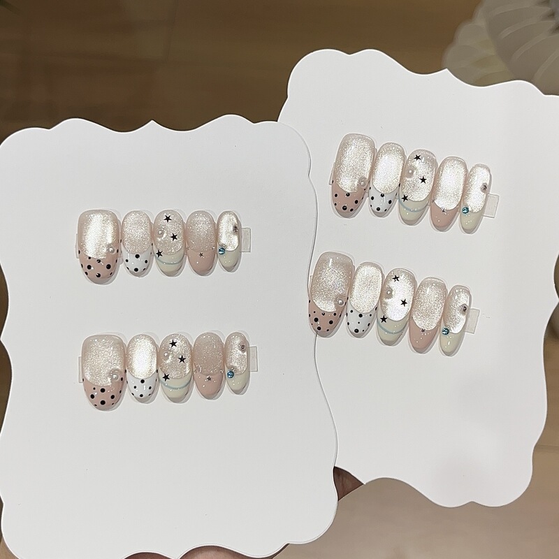 A pair of [White Peach Jelly] fresh pink cat-eye starry beige and white polka dot French-style handmade press-on nails