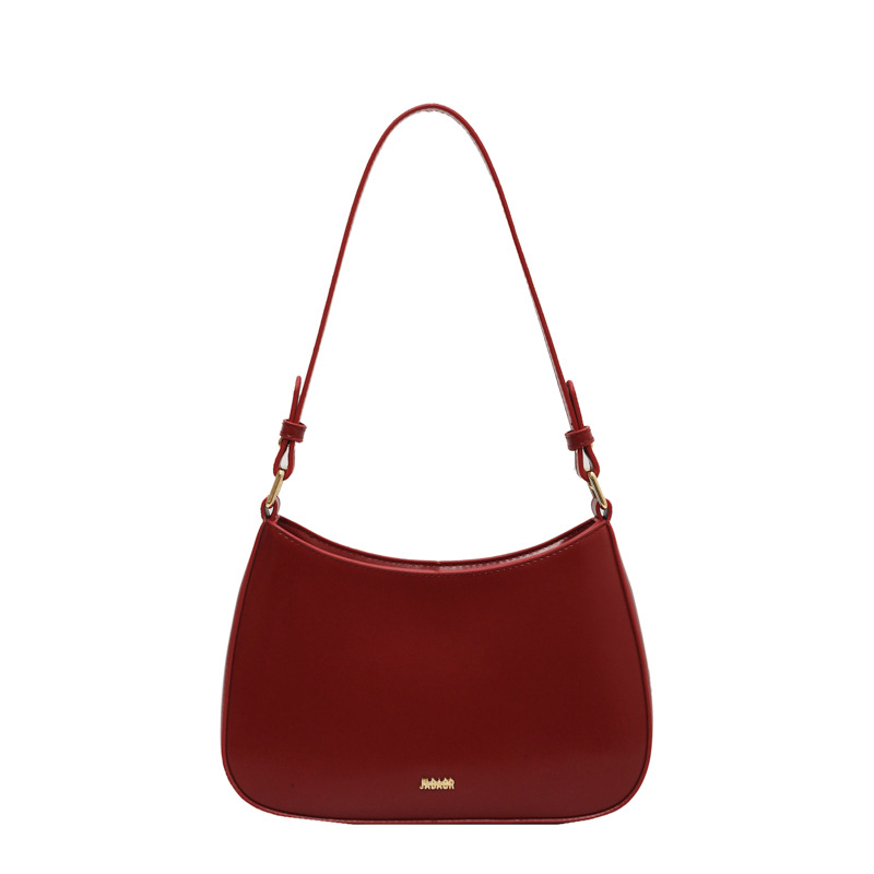 Bolso de moda de mujer 2024 verano nuevo estilo de moda bolso de brazo francés de textura simple bolso de palo nicho bolso de mochila