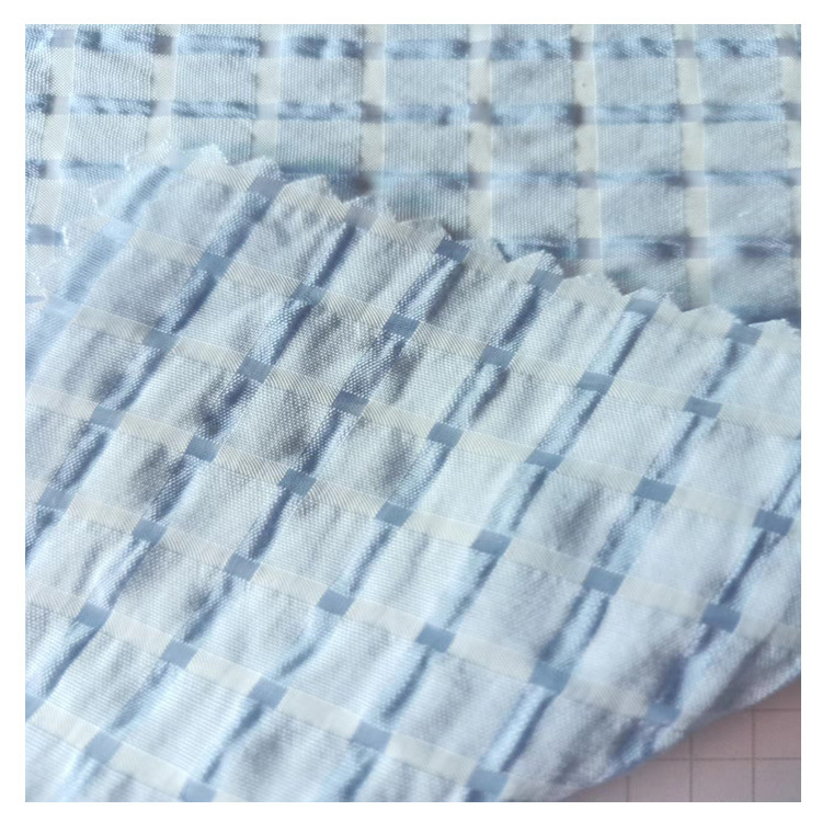 现货供应春夏女装童装连衣裙上衣衬衫面料TR混纺泡泡提花格面料