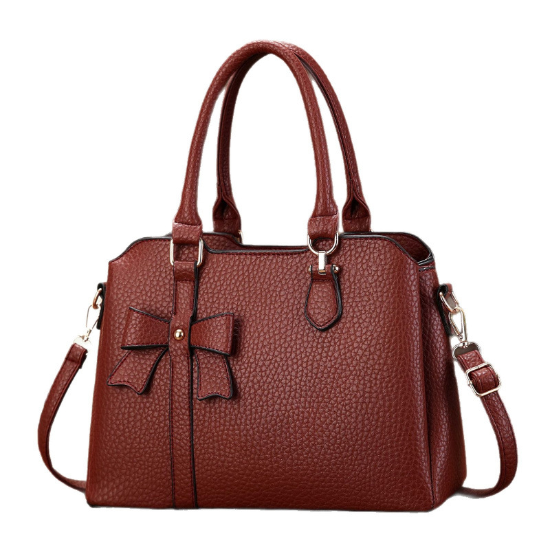 Botón arco lichi estampado bolso de mano temperamento bolso de hombro de moda casual versátil mochila bolsas transfronterizas