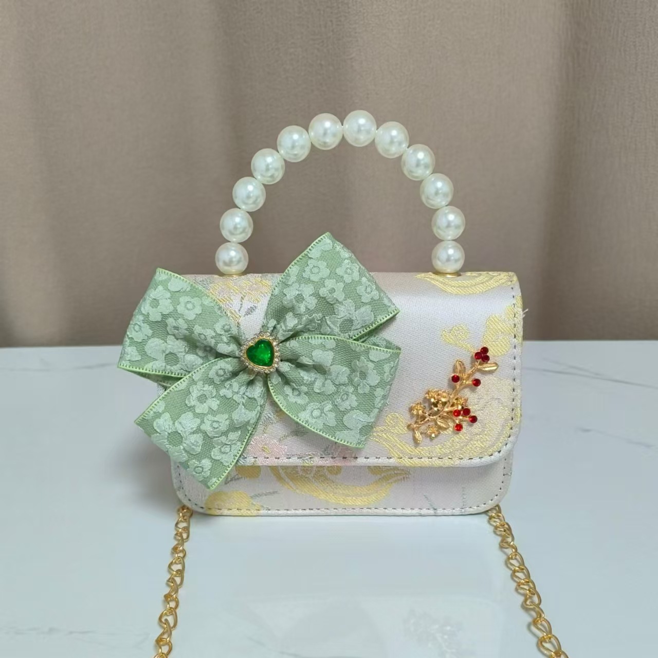 Bolso infantil nuevo bolso de hombro de niñas lindos bolsos de perlas de princesa arco de mariposa estilo nacional bolso de mochila pequeña bolsa