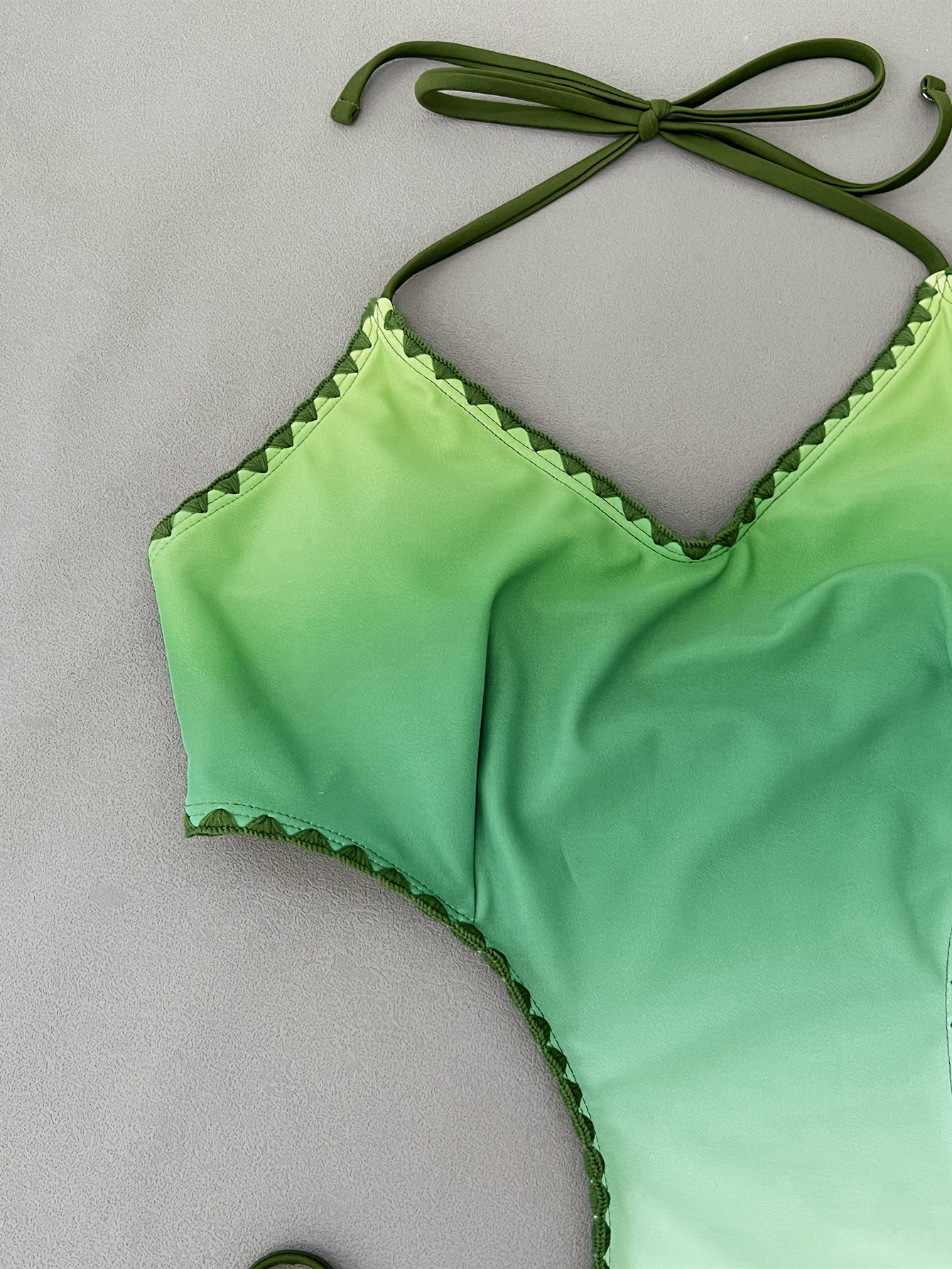 Gradient green to white swimsuit side detail with ties