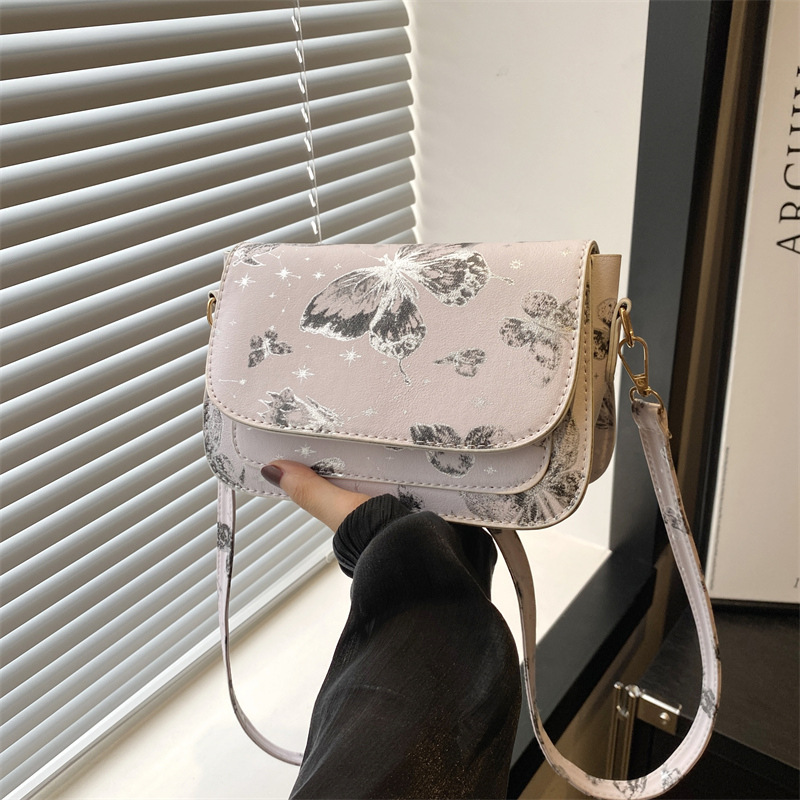 Bolso de hombro de textura bolso de mujer 2024 otoño nuevo estilo hermoso mariposa impresión de moda mochila casual bolso pequeño