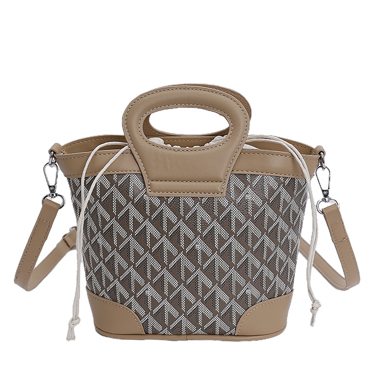 Bolsa de cubo de tela coreana para mujeres 2025 nueva moda transfronteriza nicho de alta calidad bolso de hombro