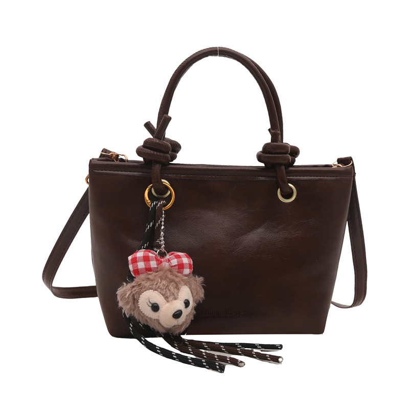 Bolso de moda simple 2024 invierno nuevo estilo retro textura bolso de cubo de moda color sólido viaje mochila de hombro