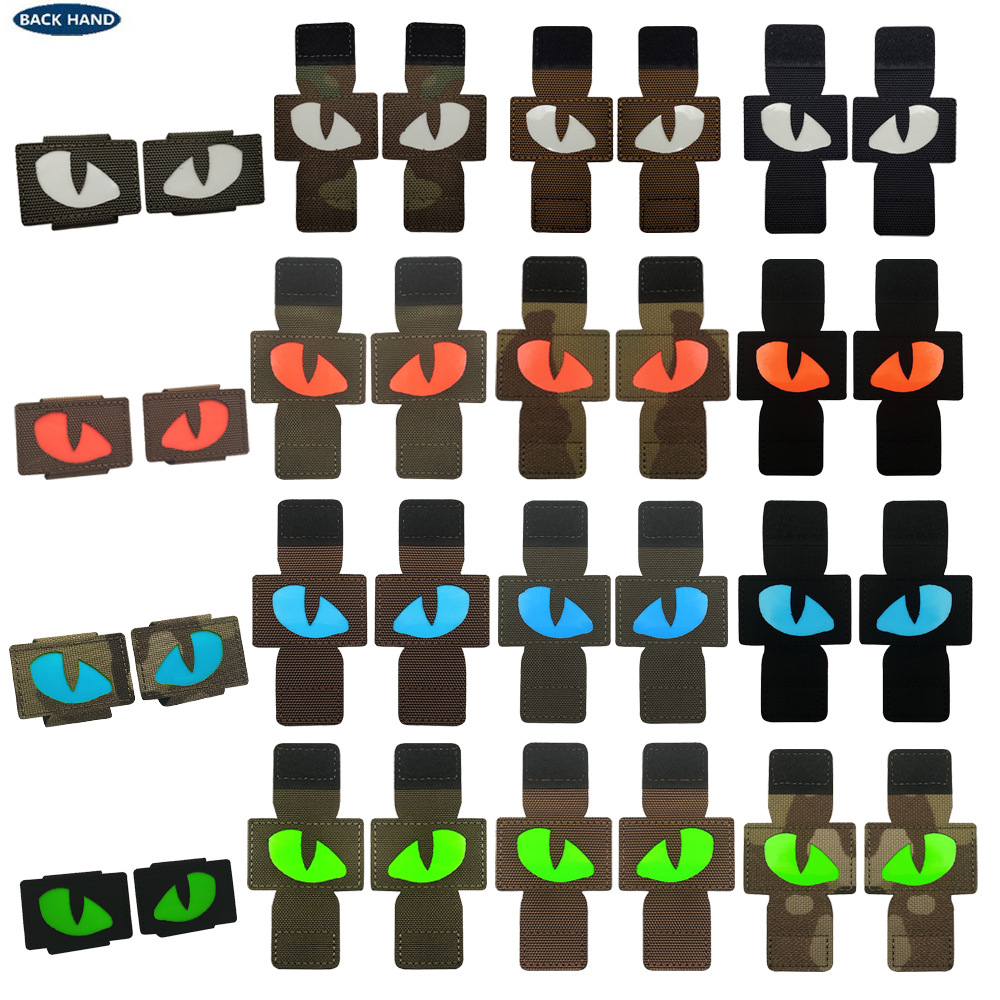Creativo suministro personalizado gato ojo luminoso moral sello al aire libre militar fan mochila sello pequeño diablo militar MOLLE colgante
