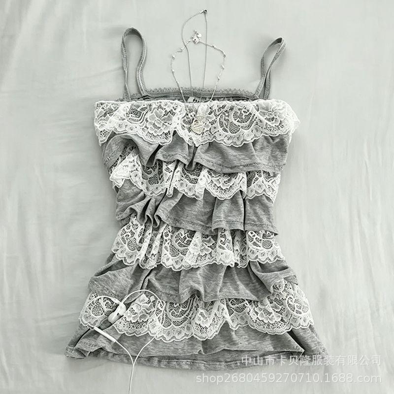 Y2K millennium style gray layered camisole with four layers of ruffles and lace trim, slim fit, can be worn as outerwear, with thin straps Y2K millennium style gray layered camisole with four layers of ruffles and lace trim, slim fit, can be worn as outerwear, with thin straps