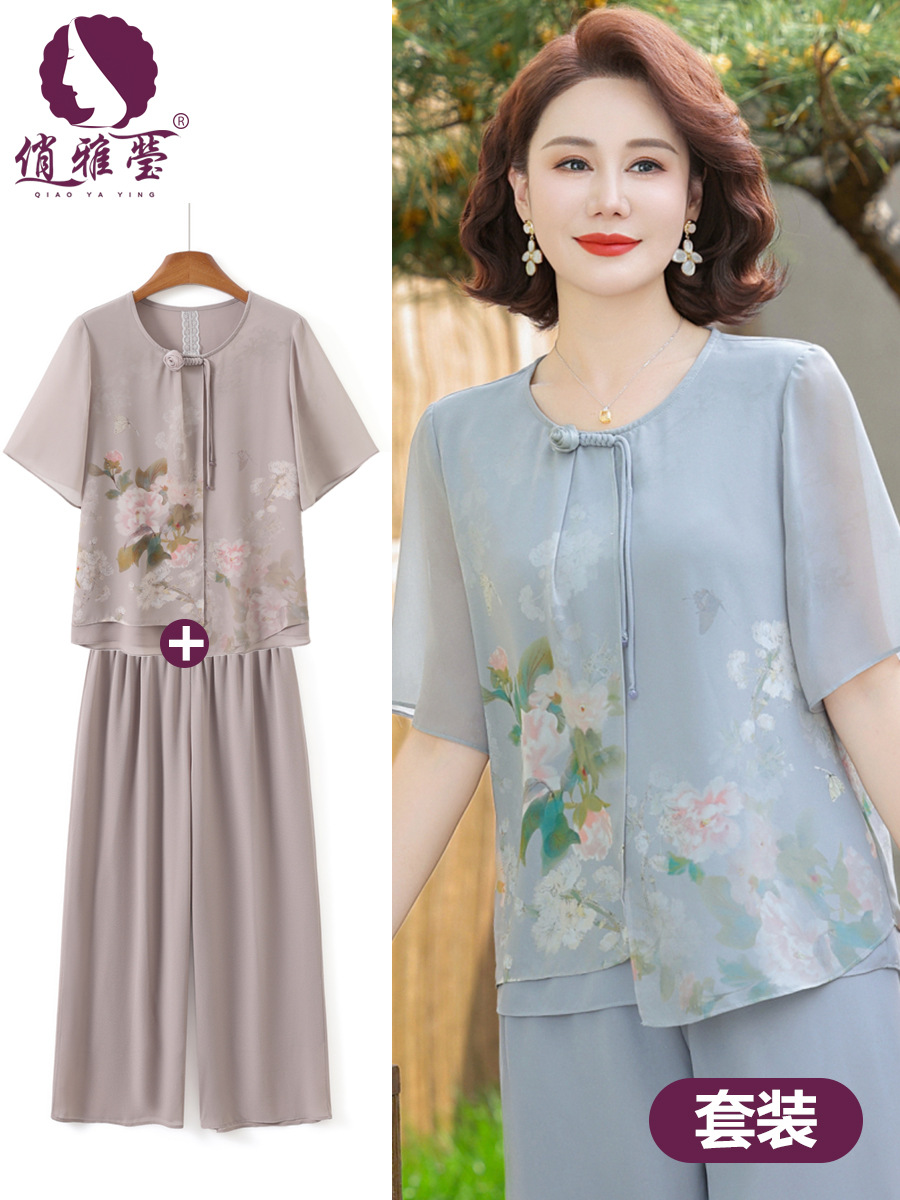 50代のお母さんの夏服のスーツの新しい中国式のプリントの半袖の広い奥さんの中高年の婦人服のシフォンのシャツの2つのセット