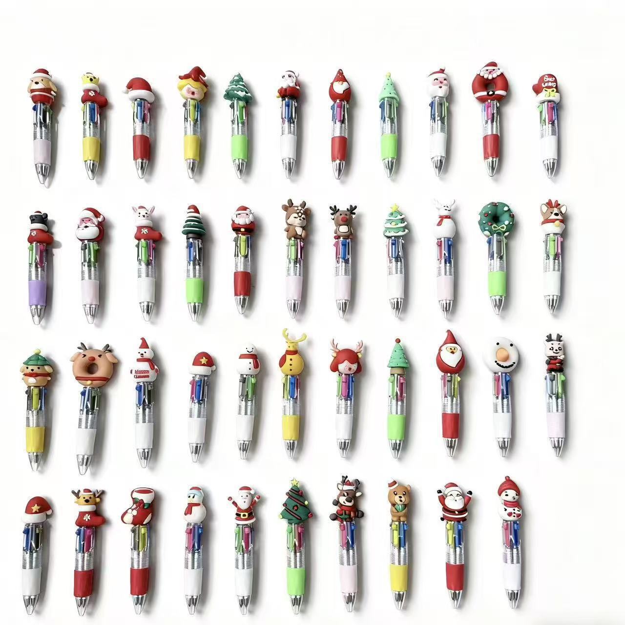 Bolígrafos navideños de cuatro colores mezclados al azar.