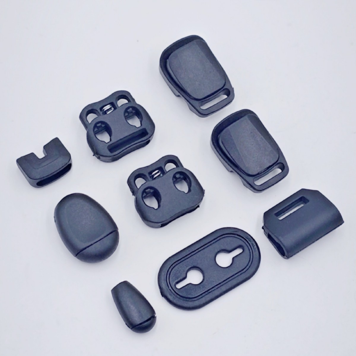 弹簧扣塑料调节纽扣黑色猪鼻扣吊钟衣帽双孔圆形穿绳扣子厂家