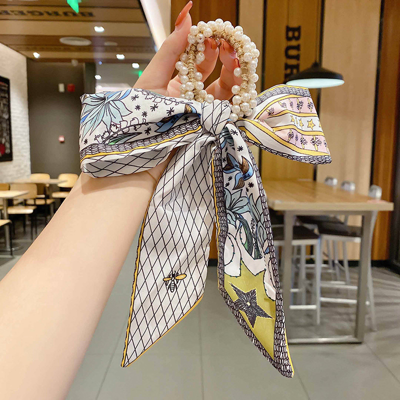 Banda de pelo de bufanda de seda corbata de pelo femenina Shixi Cinta de lazo de perla sale todo partido cuerda de cabeza Shixi 2021 cabello nuevo