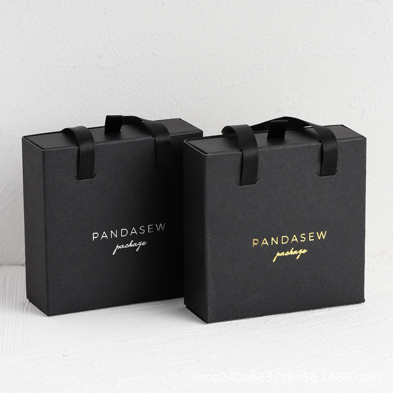 陽に花を咲かせるxpandasewはロゴを印刷して黒い手持ち式の引き出しの箱のネックレスのイヤリングの指輪のピアスの箱を印刷します。|undefined