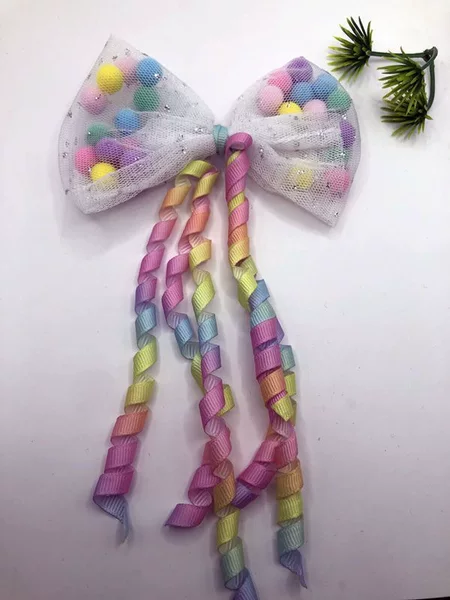 Wholesale of small, rolled ball-shaped ribbon bows, accessories, and embellishments; colorful hair ornaments and headpieces; cross-border sales