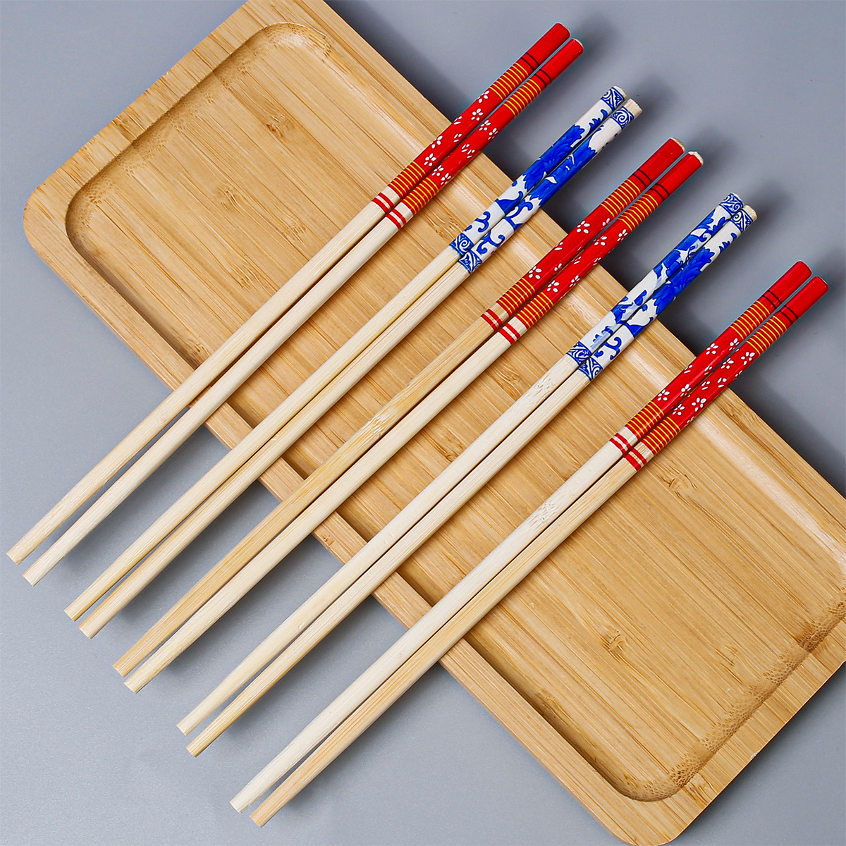 Palillos desechables grandes lotes de palillos redondos gruesos y largos de 24cm 50 pares de un paquete de palillos de película de impresión Embalaje independiente al por mayor