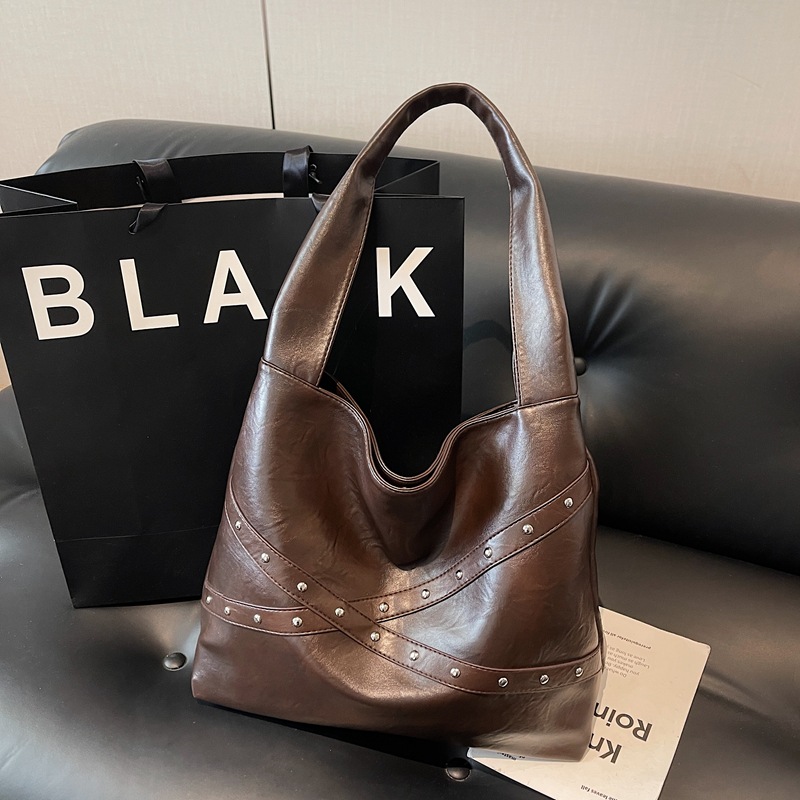 Transfronterizos retro nicho bolsas de cubo portátiles 2025 nuevo transporte de gran capacidad bolsa bolsa de hombro de locomotora