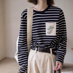 「白い絵の仕事の間」「海岸からの手紙」のストライプのtシャツの女性の長袖の純綿の正の肩幅の松の丸首の上着