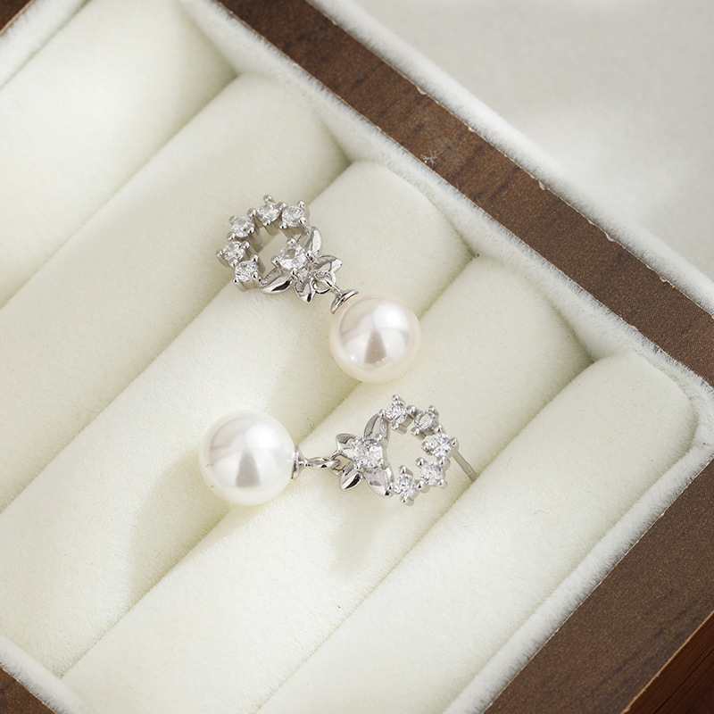 925 plata esterlina temperamento perlas perlas de verano alta sensación de moda flor de piedra arco pendientes para mujeres