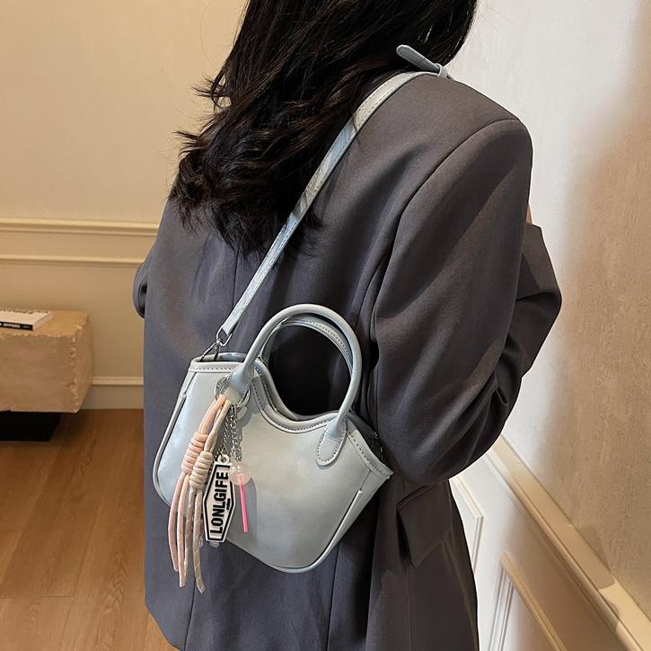 Bolso de tendencia extranjera, bolso de mano de mujer 2025, nuevo estilo de moda, bolso de cubo de hombro casual, mochila de textura de alta calidad