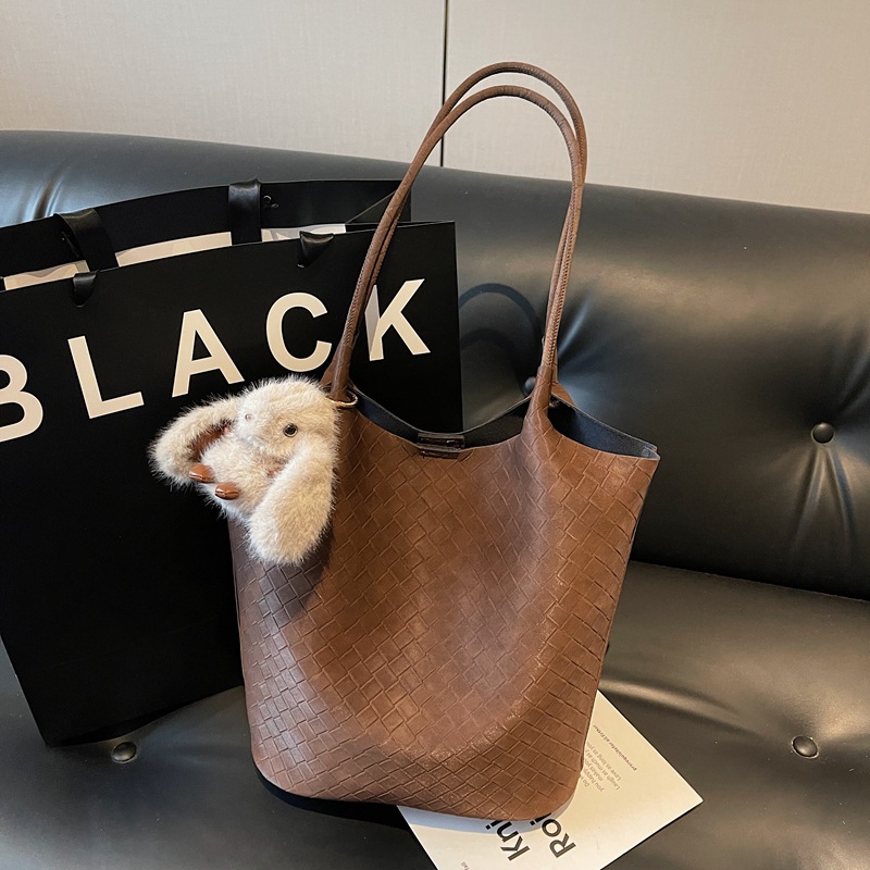 2025 nuevo bolso de mujer coreano retro bolso de cubo de mano nicho bolso de tejido de gran capacidad de viaje de hombro bolso de madre