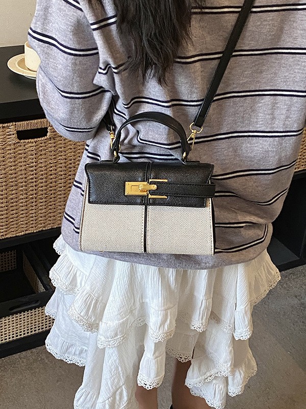 Lujo ligero color contrastante empalme bolso de mano pequeño para mujeres 2026 ventas calientes nueva moda versátil alta sensación mochila