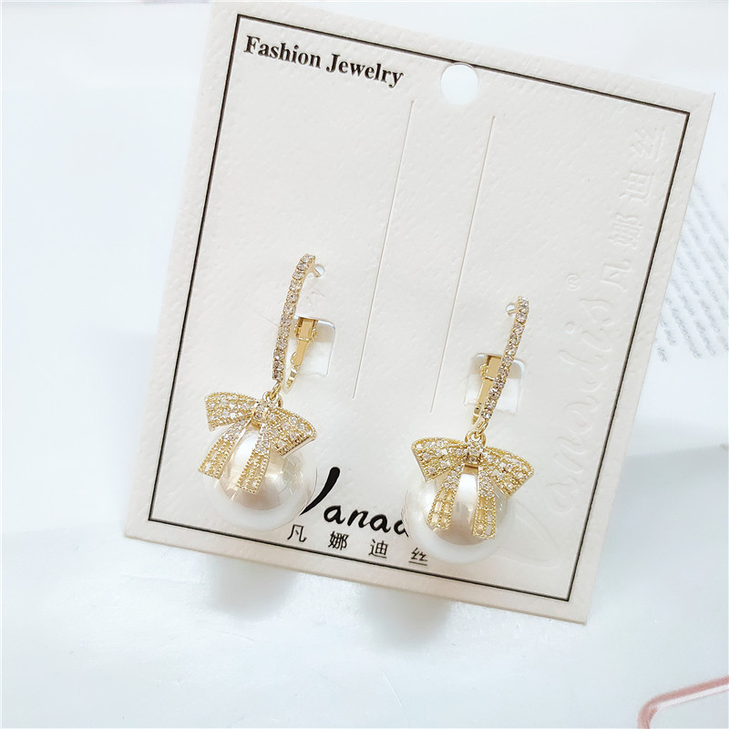 Fashion Pearl Bow Earrings display picture 6