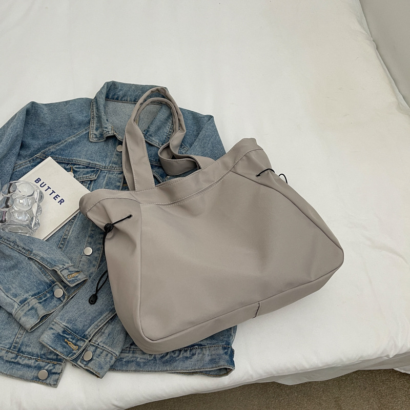 Bolso casual coreano de moda de gran capacidad de color puro 2024 primavera nuevo bolso de axila de un solo hombro ins de todo fósforo