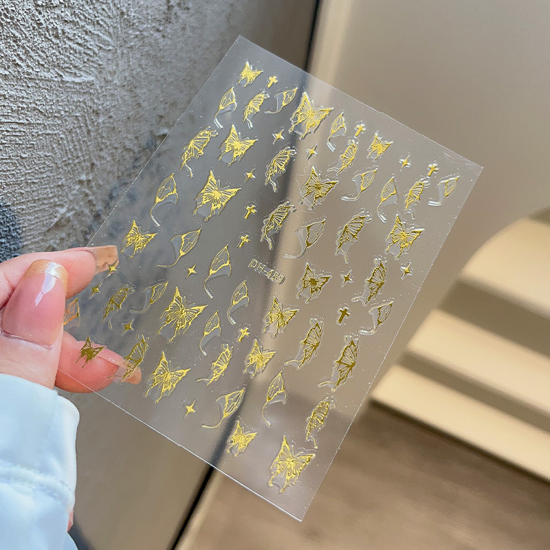 液体の蝶のネイルシールの立体レーザーと金銀の白黒の蝶の薄い靭性帯のゴムを背負って花の爪を貼って卸売りを貼ります。|undefined