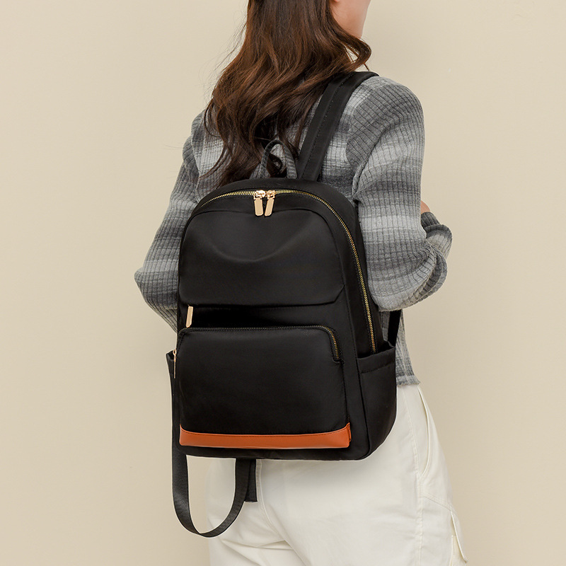 Mochila para computadora de 14 pulgadas para mujer 2024 nueva mochila casual para mujer moda color de contraste mochila escolar para estudiantes de secundaria al por mayor