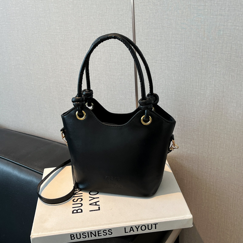 2025 nuevo bolso pequeño de estilo occidental simple y popular bolso de mensajero de moda de verano femenino bolso de cubo portátil casual