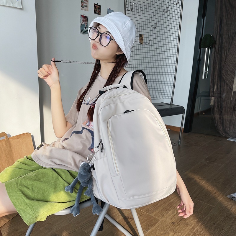 日本の学院の風の大学生のリュックサックの男性のファッションの純色の高校生のカバンの女性のシンプルな日常のレジャーのリュックサック|undefined