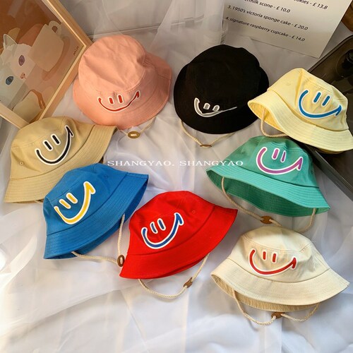 Korean-style children's hats laughing face fisherman hats candy-colored personalized unisex children versatile sunshade windproof bucket hats for outings