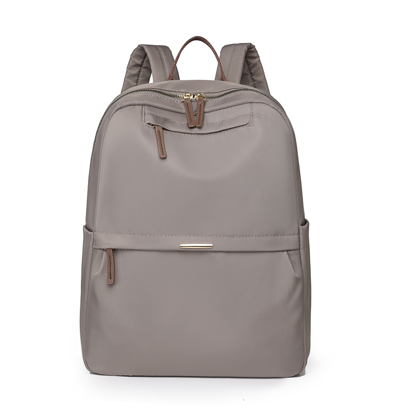 En stock al por mayor 2024 nuevas mujeres mochila de nylon simple color sólido gran capacidad ordenador mochila estudiante
