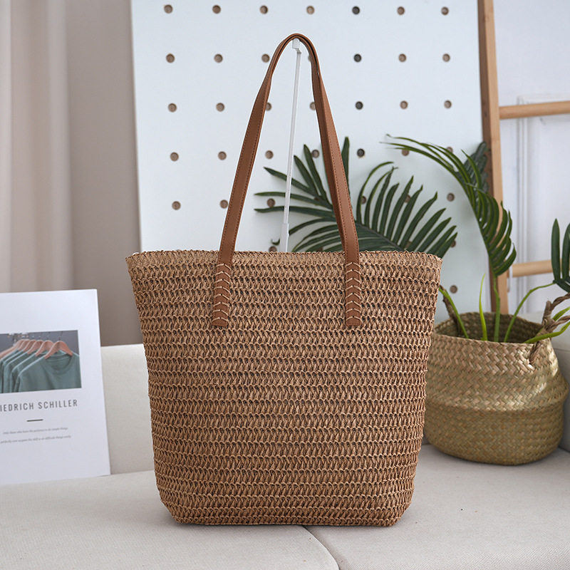 Bolsa de paja estilo de vacaciones bolsa tejida de verano modelo femenino 2025 de gran capacidad para ir al trabajo y a la escuela bolsa de viaje al por mayor