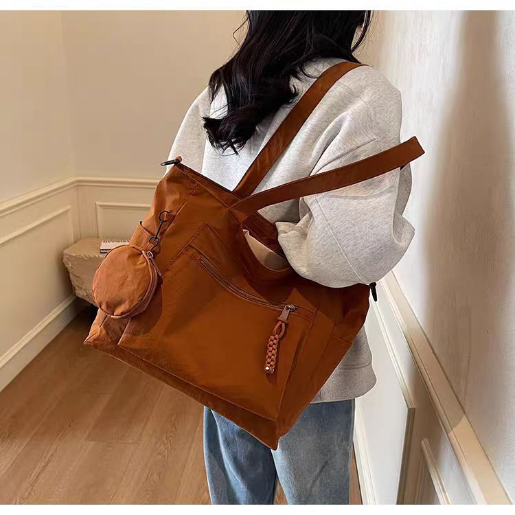 Transfronterizos casuales de color sólido nylon bolso de mano nueva bolsa de tela de transporte de gran capacidad simple y ligera mochila de hombro