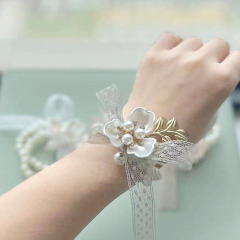 花嫁の手首の花の結婚式の花嫁のブレスレットのイベントのビーズの花の手の串は真珠のビーズの手の花をまねます。