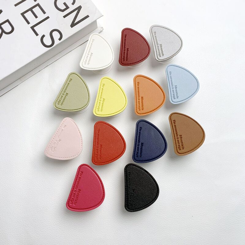 Irregular English-Style Mobile Phone Airbag Stand with Adhesive Transparent Base, Leather, Simple and Stylish, Sturdy for Desktop Use, Perfect for Watching Shows Irregular English-Style Mobile Phone Airbag Stand with Adhesive Transparent Base, Leather, Simple and Stylish, Sturdy for Desktop Use, Perfect for Watching Shows