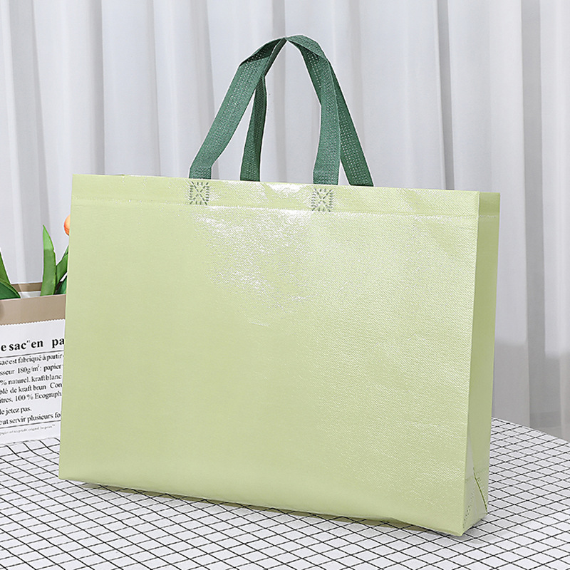 Bolso no tejido recubierto de color sólido en stock bolsa de ropa no tejida bolsa de publicidad de educación escolar urgente logotipo impreso