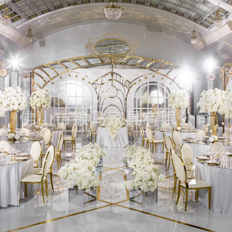 Fábrica al por mayor Hotel banquete boda comedor silla boda galvanoplastia Silla de acero inoxidable Bolsa De Oro suave Silla de comedor de cuero