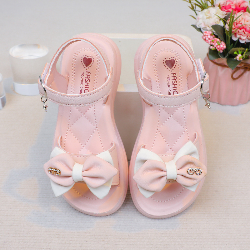 Sandalias para niñas, estilo verano 2026, con lazo y diamantes de imitación, para niñas pequeñas, con suela suave, para la playa