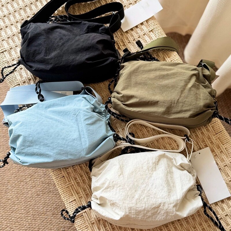 Korean Niche Trendy Brand Em Nylon Drawstring Canvas Nylon Bag New Sports Casual Shoulder Crossbody Dumpling Bag