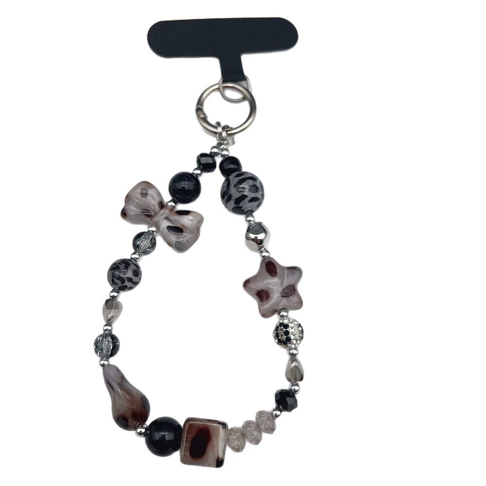 Mobile phone with bow, strap, sophisticated bracelet, pendant