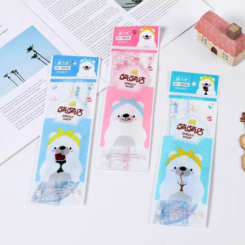 Venta al por mayor patrón de dibujos animados triángulo regla traje creativo escuela primaria estudiante 4 piezas combinación traje aprendizaje papelería recompensa regalo