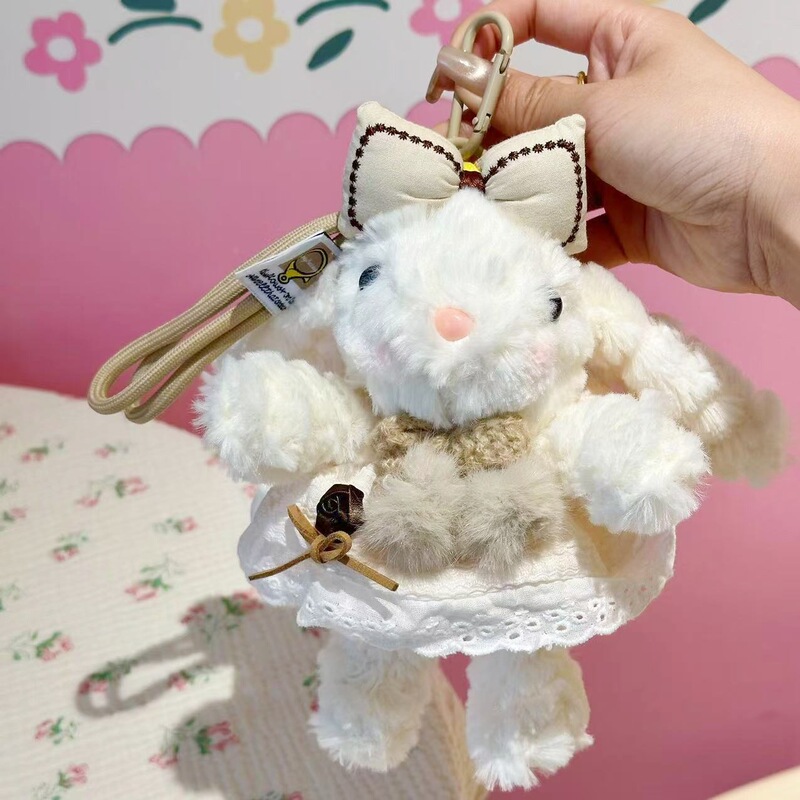 新商品の桜の耳を垂れたウサギのカバンのペンダントのぬいぐるみのキーホルダーはクリスマスプレゼントを飾ります。|undefined