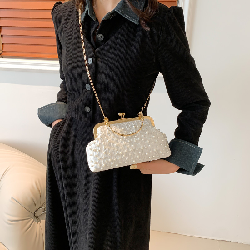 Bolso de las mujeres bolso de la cadena de la perla 2024 principios de primavera nueva moda bolso de hombro fresco dulce hermoso bolso crossbody de aspecto alto para las mujeres